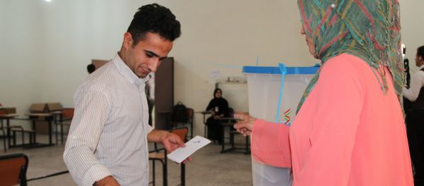 Voting at a polling station in the city of Kirkuk during an independence referendum for Iraqi Kurdistan Voting at a polling station in the city of Kirkuk during an independence referendum for Iraqi Kurdistan - Sputnik International