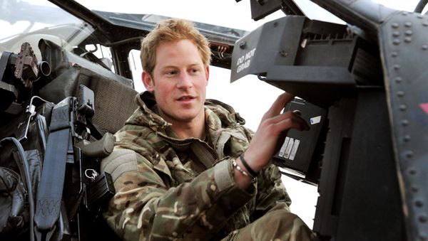 In this photo, taken 12 December 2012, made available 21 January 2013, Britain's Prince Harry or just plain Captain Wales as he is known in the British Army, makes his early morning pre-flight checks on the flight-line, from Camp Bastion southern Afghanistan.  - Sputnik International