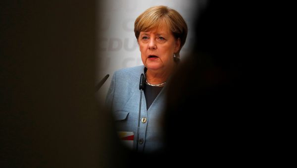 Christian Democratic Union CDU party leader and German Chancellor Angela Merkel reacts during a news conference at the CDU party headquarters, a day after the general election (Bundestagswahl) in Berlin, Germany September 25, 2017. - Sputnik International