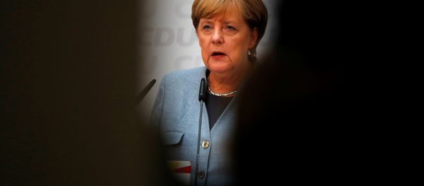 Christian Democratic Union CDU party leader and German Chancellor Angela Merkel reacts during a news conference at the CDU party headquarters, a day after the general election (Bundestagswahl) in Berlin, Germany September 25, 2017. Christian Democratic Union CDU party leader and German Chancellor Angela Merkel reacts during a news conference at the CDU party headquarters, a day after the general election (Bundestagswahl) in Berlin, Germany September 25, 2017. - Sputnik International