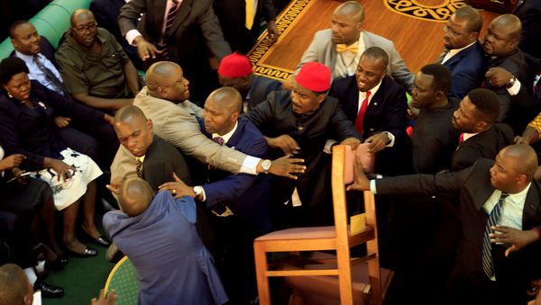 Ugandan lawmakers involve in a fight in the parliament ahead of proposed age limit amendment bill debate a move to change the constitution to extend the president's rule, in Kampala, Uganda September 26, 2017. - Sputnik International