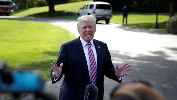 U.S. President Donald Trump speaks to reporters as he departs for Bedminster, New Jersey, from the White House in Washington, U.S., September 29, 2017 - Sputnik International