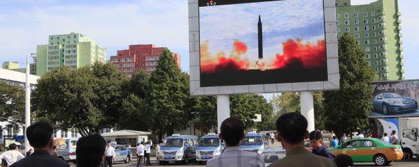 People watch a launching of a Hwasong-12 strategic ballistic rocket aired on a public TV screen at the Pyongyang Train Station in Pyongyang, North Korea, Saturday, Sept. 16, 2017 People watch a launching of a Hwasong-12 strategic ballistic rocket aired on a public TV screen at the Pyongyang Train Station in Pyongyang, North Korea, Saturday, Sept. 16, 2017 - Sputnik International