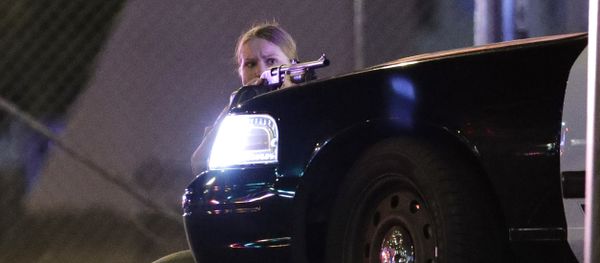 A police officer takes cover behind a police vehicle during a shooting near the Mandalay Bay resort and casino on the Las Vegas Strip, Sunday, Oct. 1, 2017, in Las Vegas A police officer takes cover behind a police vehicle during a shooting near the Mandalay Bay resort and casino on the Las Vegas Strip, Sunday, Oct. 1, 2017, in Las Vegas - Sputnik International