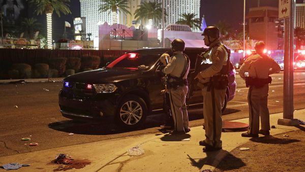 Police stand at the scene of a shooting along the Las Vegas Strip, Monday, Oct. 2, 2017, in Las Vegas Police stand at the scene of a shooting along the Las Vegas Strip, Monday, Oct. 2, 2017, in Las Vegas - Sputnik International