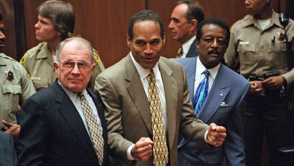 In this Oct. 3, 1995 file photo, O.J. Simpson, center, reacts as he is found not guilty of murdering his ex-wife Nicole Brown Simpson and her friend Ron Goldman, with attorneys F. Lee Bailey, left, and Johnnie Cochran Jr., right, in Los Angeles Superior Court - Sputnik International