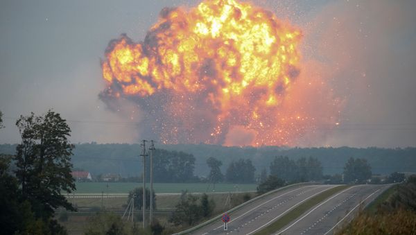 Smoke and flames rise over a warehouse storing ammunition for multiple rocket launcher systems at a military base in the town of Kalynivka in Vinnytsia region, Ukraine September 27, 2017 - Sputnik International