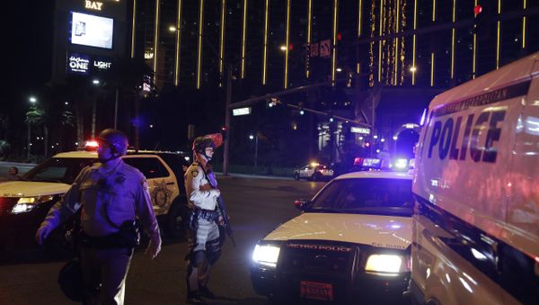 Police officers stand along the Las Vegas Strip outside the Mandalay Bay resort and casino during a deadly shooting near the casino, Sunday, Oct. 1, 2017, in Las Vegas - Sputnik International