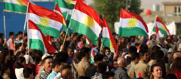 Iranian Kurds hold Kurdish flags as they take part in a gathering to urge people to vote in the independence referendum in the town of Bahirka, north of Arbil, the capital of the autonomous Kurdish region of northern Iraq. Iranian Kurds hold Kurdish flags as they take part in a gathering to urge people to vote in the independence referendum in the town of Bahirka, north of Arbil, the capital of the autonomous Kurdish region of northern Iraq. - Sputnik International