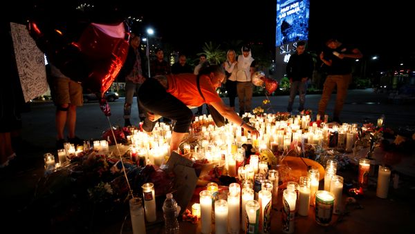 People gather at a vigil on the Las Vegas strip following a mass shooting at the Route 91 Harvest Country Music Festival in Las Vegas, Nevada, U.S., October 3, 2017 People gather at a vigil on the Las Vegas strip following a mass shooting at the Route 91 Harvest Country Music Festival in Las Vegas, Nevada, U.S., October 3, 2017 - Sputnik International