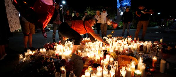 People gather at a vigil on the Las Vegas strip following a mass shooting at the Route 91 Harvest Country Music Festival in Las Vegas, Nevada, U.S., October 3, 2017 People gather at a vigil on the Las Vegas strip following a mass shooting at the Route 91 Harvest Country Music Festival in Las Vegas, Nevada, U.S., October 3, 2017 - Sputnik International