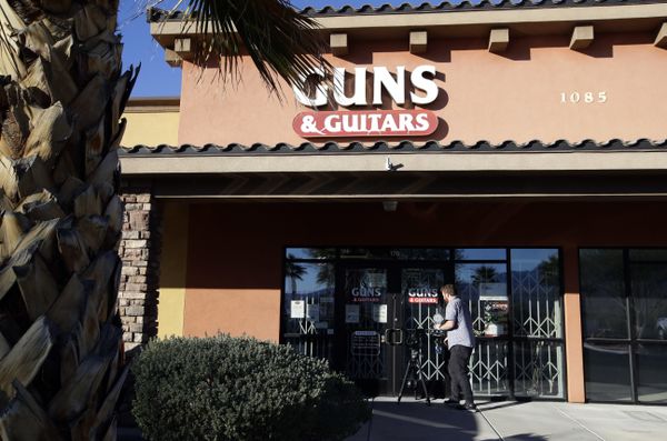 A member of the media takes video footage of the front of the Guns & Guitars store in Mesquite, Nev., Monday, Oct. 2, 2017 A member of the media takes video footage of the front of the Guns & Guitars store in Mesquite, Nev., Monday, Oct. 2, 2017 - Sputnik International