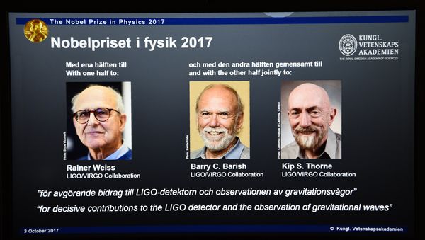 Laureates (L-R) Rainer Weiss, Barry C Barish and Kip S Thorne are pictured on a display during the announcement of the 2017 Nobel Prize winners in Physics on October 3, 2017, at the Royal Swedish Academy of Sciences in Stockholm Laureates (L-R) Rainer Weiss, Barry C Barish and Kip S Thorne are pictured on a display during the announcement of the 2017 Nobel Prize winners in Physics on October 3, 2017, at the Royal Swedish Academy of Sciences in Stockholm - Sputnik International