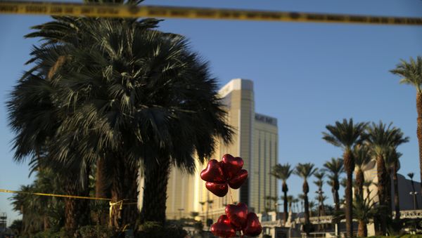 A makeshift memorial is seen next to the site of the Route 91 music festival mass shooting outside the Mandalay Bay Resort and Casino in Las Vegas, Nevada, U.S - Sputnik International