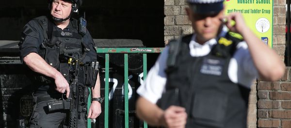 Armed British police officers stand on duty outside Parsons Green underground tube station in west London on September 15, 2017, following an incident on an underground tube carriage at the station Armed British police officers stand on duty outside Parsons Green underground tube station in west London on September 15, 2017, following an incident on an underground tube carriage at the station - Sputnik International