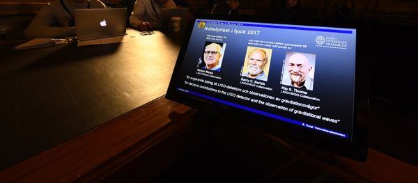 Laureates (L-R) Rainer Weiss, Barry C Barish and Kip S Thorne are pictured on a display during the announcement of the 2017 Nobel Prize winners in Physics on October 3, 2017, at the Royal Swedish Academy of Sciences in Stockholm - Sputnik International