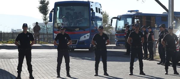 Riot police stand guard as prison vehicles, carrying soldiers accused of attempting to assassinate Turkish President Tayyip Erdogan on the night of the failed last year's July 15 coup arrive for a trial in Mugla, Turkey Riot police stand guard as prison vehicles, carrying soldiers accused of attempting to assassinate Turkish President Tayyip Erdogan on the night of the failed last year's July 15 coup arrive for a trial in Mugla, Turkey - Sputnik International