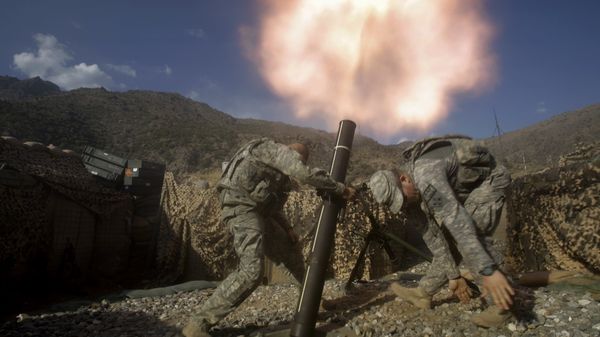 US soldiers from the 2nd Battalion, 12th Infantry Regiment, 4th Brigade Combat Team, fire mortars at known enemy firing positions from a base in the Pech River Valley in Afghanistan's Kunar province, Saturday, Oct. 24, 2009. - Sputnik International