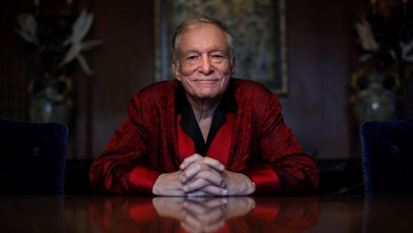 In this Nov. 4, 2010, file photo, Playboy magazine founder Hugh Hefner poses for photos at the Playboy Mansion in Los Angeles. - Sputnik International