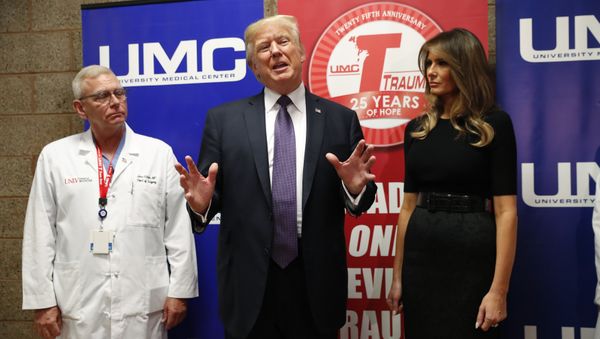 U.S. President Donald Trump speaks with reporters with first lady Melania Trump and UNLV Trauma Center Medical Director John Fildes after meeting with patients in the wake of the mass shooting in Las Vegas, Nevada, U.S., October 4, 2017 U.S. President Donald Trump speaks with reporters with first lady Melania Trump and UNLV Trauma Center Medical Director John Fildes after meeting with patients in the wake of the mass shooting in Las Vegas, Nevada, U.S., October 4, 2017 - Sputnik International