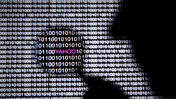 A man in front of a Yahoo logo seen through a magnifying glass in front of a displayed cyber code (File) - Sputnik International