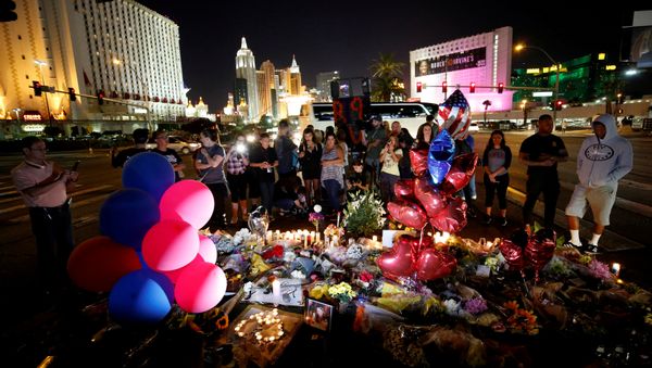People gather at a makeshift memorial in the middle of Las Vegas Boulevard following the mass shooting in Las Vegas, Nevada, U.S., October 4, 2017 - Sputnik International