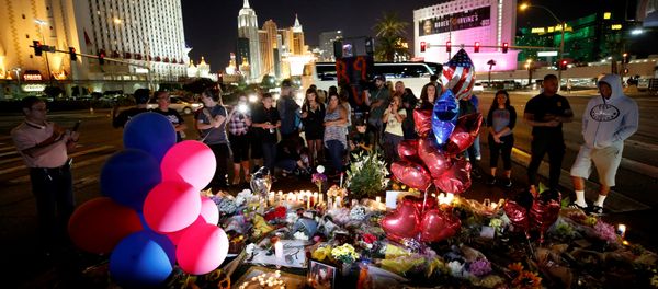 People gather at a makeshift memorial in the middle of Las Vegas Boulevard following the mass shooting in Las Vegas, Nevada, U.S., October 4, 2017 People gather at a makeshift memorial in the middle of Las Vegas Boulevard following the mass shooting in Las Vegas, Nevada, U.S., October 4, 2017 - Sputnik International