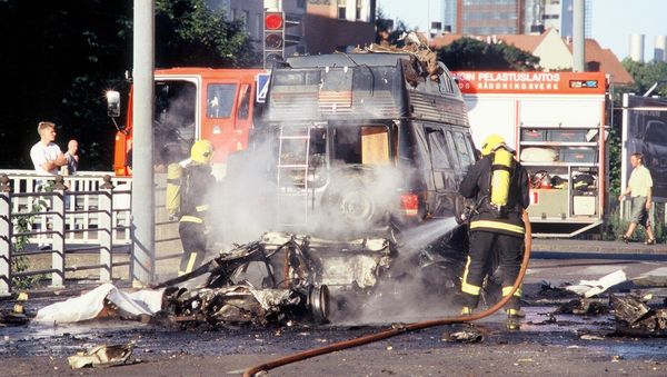 Firefighters work  at the site where a car bomb exploded outside a hotel in central Helsinki earlier in the day, killing one person, the occupant of the car, and seriously hurting another man, according to the police (File) - Sputnik International