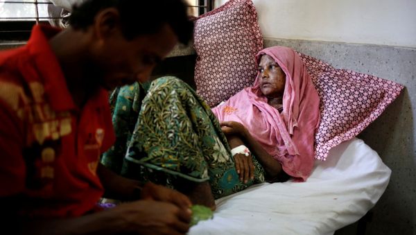 Shaheda, 40, a Rohingya refugee woman who said her body was burnt when the Myanmar army set fire to her house, receives treatment at the Cox's Bazar District Sadar Hospital in Cox's Bazar, Bangladesh, September 13, 2017 Shaheda, 40, a Rohingya refugee woman who said her body was burnt when the Myanmar army set fire to her house, receives treatment at the Cox's Bazar District Sadar Hospital in Cox's Bazar, Bangladesh, September 13, 2017 - Sputnik International