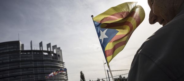 A demonstrator waves a Catalan flag in support of the disputed independence vote Sunday in Catalonia during a gathering in front of the European Parliament in Strasbourg, eastern France, Wednesday, Oct. 4, 2017 A demonstrator waves a Catalan flag in support of the disputed independence vote Sunday in Catalonia during a gathering in front of the European Parliament in Strasbourg, eastern France, Wednesday, Oct. 4, 2017 - Sputnik International