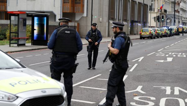 Police officers stand in the road near the Natural History Museum, after a car mounted the pavement injuring a number of pedestrians, police said, in London, Britain October 7, 2017 - Sputnik International
