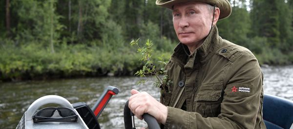 Russian President Vladimir Putin on a motor boat at the cascade of mountain lakes in the Republic of Tyva, during his vacation on August 1-3 Russian President Vladimir Putin on a motor boat at the cascade of mountain lakes in the Republic of Tyva, during his vacation on August 1-3 - Sputnik International