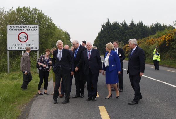 The European Union's chief negotiator Michel Barnier, front left, and Charles Flanagan, center, Minister for Foreign Affairs walk along the Irish border close to Castleblayney, Ireland, Friday, May 12, 2017.  - Sputnik International