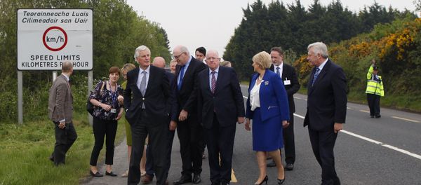 The European Union's chief negotiator Michel Barnier, front left, and Charles Flanagan, center, Minister for Foreign Affairs walk along the Irish border close to Castleblayney, Ireland, Friday, May 12, 2017. - Sputnik International