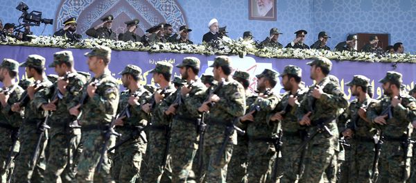 Iran's President Hassan Rouhani, top center, reviews army troops marching during the 37th anniversary of Iraq's 1980 invasion of Iran, in front of the shrine of the late revolutionary founder, Ayatollah Khomeini, just outside Tehran, Iran, Friday, Sept. 22, 2017 Iran's President Hassan Rouhani, top center, reviews army troops marching during the 37th anniversary of Iraq's 1980 invasion of Iran, in front of the shrine of the late revolutionary founder, Ayatollah Khomeini, just outside Tehran, Iran, Friday, Sept. 22, 2017 - Sputnik International