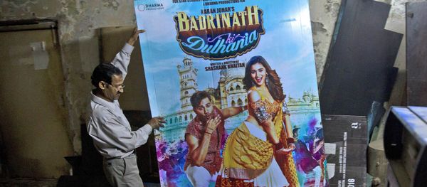 In this Tuesday, March 28, 2017 photo, an employee places a poster of a Bollywood film in the dump room of Regal Theater in New Delhi, India In this Tuesday, March 28, 2017 photo, an employee places a poster of a Bollywood film in the dump room of Regal Theater in New Delhi, India - Sputnik International