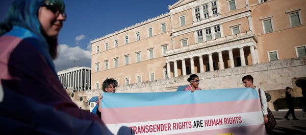 Protesters take part in a demonstration as the Greek Parliament debates bill allowing people to choose legal gender, in Athens, Greece, October 9, 2017. - Sputnik International