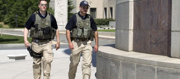 US Marshalls move outside the federal US District Court in Washington Saturday, June 28, 2014, after security was heightened in anticipation of a possible court appearance by captured Libyan militant Ahmed Abu Khattala later in the day. US Marshalls move outside the federal US District Court in Washington Saturday, June 28, 2014, after security was heightened in anticipation of a possible court appearance by captured Libyan militant Ahmed Abu Khattala later in the day. - Sputnik International
