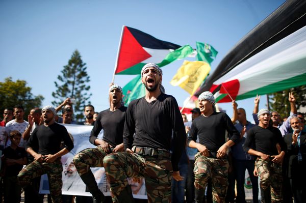 Palestinians parade during celebrations after Hamas said it reached a deal with Palestinian rival Fatah, in Gaza City Palestinians parade during celebrations after Hamas said it reached a deal with Palestinian rival Fatah, in Gaza City - Sputnik International