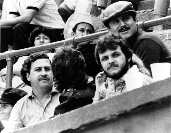 Pablo Escobar, left, and Jorga Luis Ochoa, right with hat, the two leaders of the Medellin cocaine cartel, are shown at a bullfight in Medellin, Colombia, in 1984 - Sputnik International