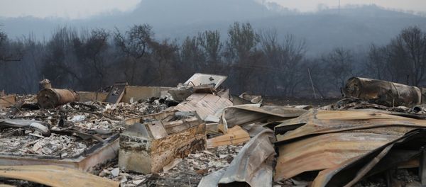 A structure destroyed by wildfire smolders outside Calistoga, California, U.S. October 12, 2017. - Sputnik International