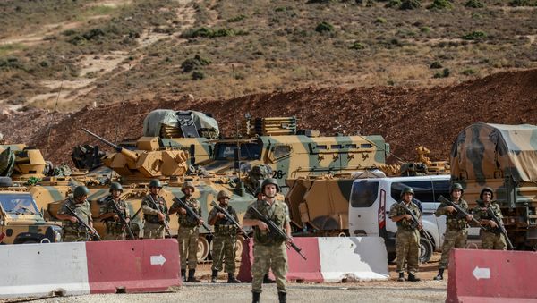Turkish soldiers stand near armoured vehicles during a demonstration in support of the Turkish army's Idlib operation near the Turkey-Syria border near Reyhanli, Hatay, on October 10, 2017 Turkish soldiers stand near armoured vehicles during a demonstration in support of the Turkish army's Idlib operation near the Turkey-Syria border near Reyhanli, Hatay, on October 10, 2017 - Sputnik International