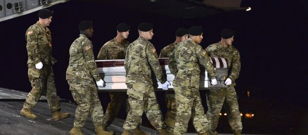 In this image provided by the US Air Force, a US Army carry team transfers the remains of Army Staff Sgt. Dustin Wright of Lyons, Ga., late Thursday, Oct. 5, 2017, upon arrival at Dover Air Force Base, Del. Wright, 29, of Lyons, Ga., was one of four US troops and four Niger forces killed in an ambush by dozens of Islamic extremists on a joint patrol of American and Niger Force. In this image provided by the US Air Force, a US Army carry team transfers the remains of Army Staff Sgt. Dustin Wright of Lyons, Ga., late Thursday, Oct. 5, 2017, upon arrival at Dover Air Force Base, Del. Wright, 29, of Lyons, Ga., was one of four US troops and four Niger forces killed in an ambush by dozens of Islamic extremists on a joint patrol of American and Niger Force. - Sputnik International