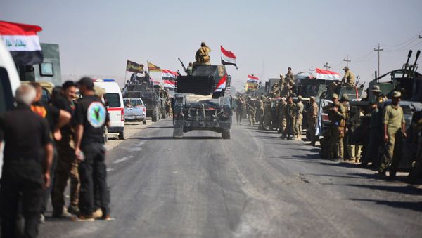 Members of Iraqi federal forces gather to continue to advance in military vehicles in Kirkuk, Iraq - Sputnik International