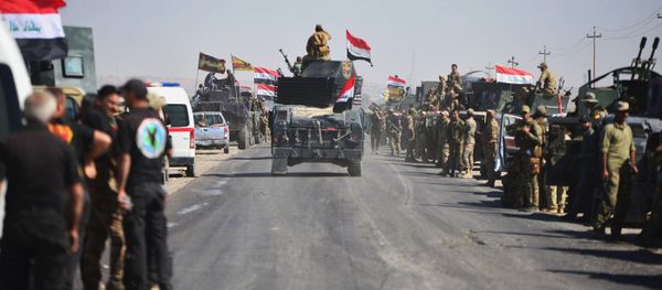 Members of Iraqi federal forces gather to continue to advance in military vehicles in Kirkuk, Iraq - Sputnik International