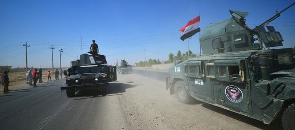Members of Iraqi federal forces gather to continue to advance in military vehicles in Kirkuk, Iraq - Sputnik International