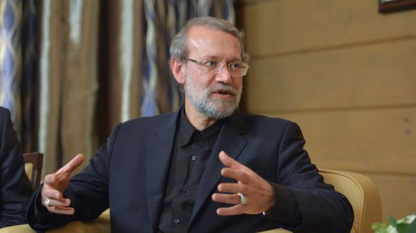 Speaker of the Islamic Consultative Council (parliament) of the Islamic Republic of Iran Ali Larijani during a meeting with Russian President Vladimir Putin following the 12th annual meeting of the Valdai International Discussion Club. File photo - Sputnik International