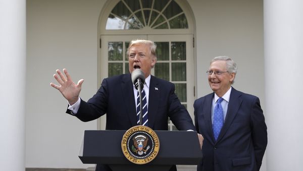 President Donald Trump answers questions with Senate Majority Leader Mitch McConnell, R-Ky., in the Rose Garden after their meeting at the White House, Monday, 16 October 2017, in Washington. President Donald Trump answers questions with Senate Majority Leader Mitch McConnell, R-Ky., in the Rose Garden after their meeting at the White House, Monday, 16 October 2017, in Washington. - Sputnik International