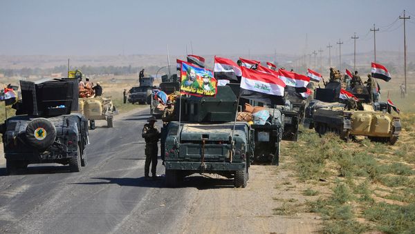 Members of Iraqi federal forces gather to continue to advance in military vehicles in Kirkuk, Iraq October 16, 2017. - Sputnik International