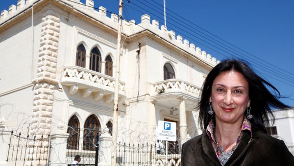 Maltese investigative journalist Daphne Caruana Galizia poses outside the Libyan Embassy in Valletta April 6, 2011. Investigative journalist Caruana Galizia was killed after a powerful bomb blew up a car killing her in Bidnija, Malta, in October 16, 2017. - Sputnik International